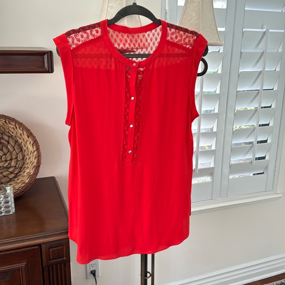 A Rebecca Taylor shirt. Tomato red w a lace
Trim on back and middle front